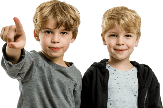 Two Smiling Boys Pointing and Posing Together with Joyful Expressions png