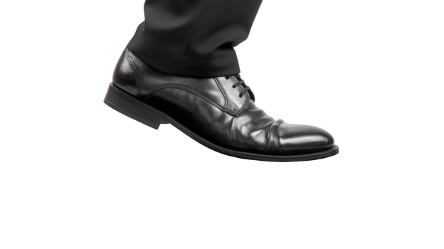 Black leather shoe striking padded surface with transparent background png