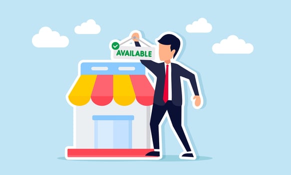 Businessman standing next to a store holding a hanging tag with the word available illustration of building availability for commercial property rental vector