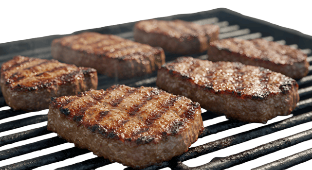 Grilled Square Burger Patties with Distinct Grill Marks on a Black Grill png