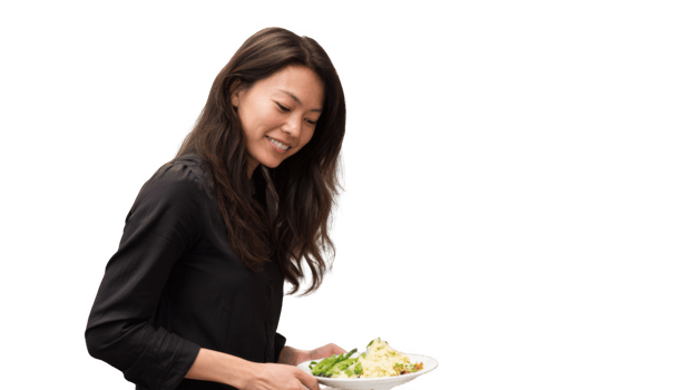 Smiling office worker holding plate with healthy meal on transparent background png