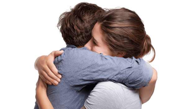 Young woman and man sharing a warm hug on transparent background png