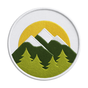 Round embroidered patch features design of green mountains with white peaks against yellow sun, surrounded by green trees. patch has white border, creating clean and vibrant outdoor theme png