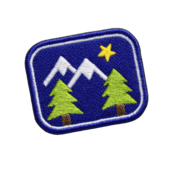 Rectangular embroidered patch features mountain scene with two green trees and yellow star on blue background, symbolizing adventure and nature png