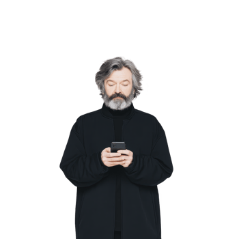 Mature man with gray beard and hair is wearing black turtleneck, looking at his smartphone with focused expression against plain background png