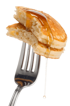 Pancakes with syrup on fork isolated on transparent background, breakfast food close-up, dripping maple syrup png