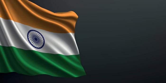 India national flag waving on dark background vector