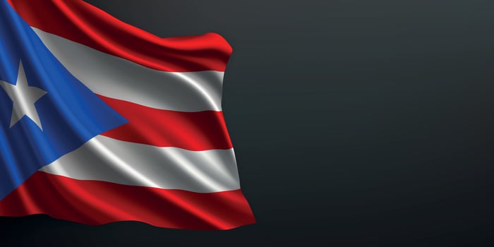 Puerto Rico national flag waving on dark background vector