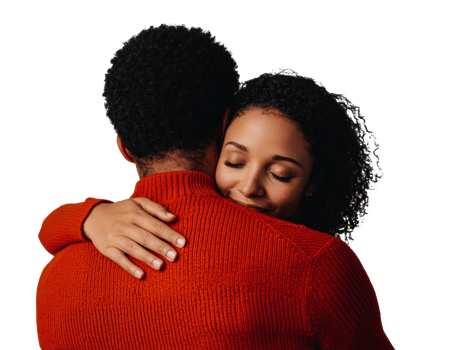 Warm embrace between couple in cozy clothing during joyful moment png