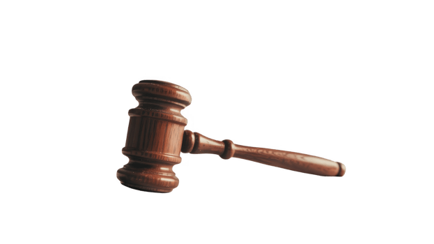 Wooden gavel striking sound block on transparent background png