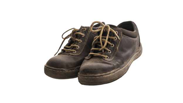 Pair of well worn work boots isolated on transparent background png