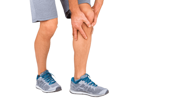 Athlete touching sore knee while standing on transparent background png