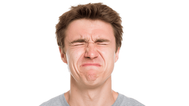 Young man wincing in discomfort with transparent background png
