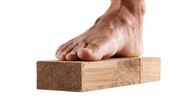 Powerful foot pressing against wooden blocks on transparent background png