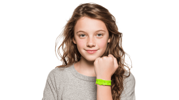 Young girl showing wristband on transparent background png