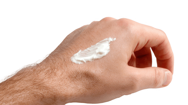 Man applying topical cream on hand with transparent background png