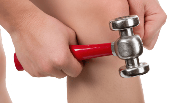 Doctor testing knee reflex with a reflex hammer on transparent background png