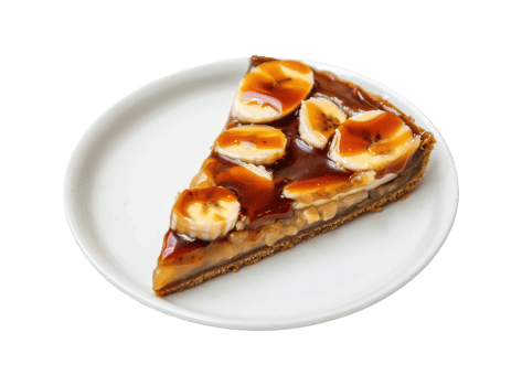 A slice of banoffee pie topped with sliced bananas and caramel sauce on a white plate isolated on a transparent background png