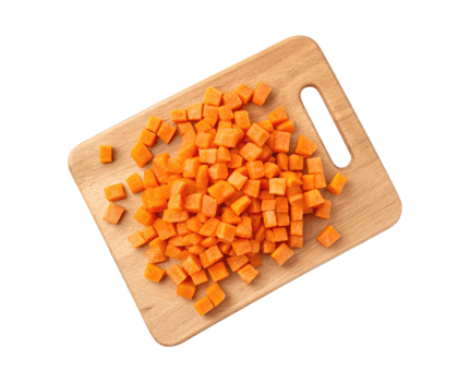 A carrot cubes on a cutting board isolated on a transparent background food design png