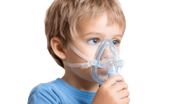 Child using inhaler mask for respiratory therapy on transparent background png