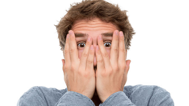 Young man showing panic gesture with hands covering face png