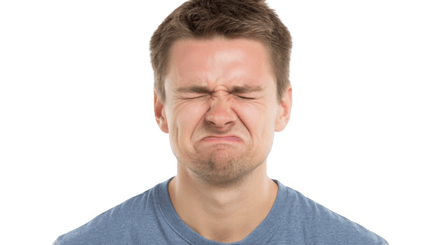 Man grimacing and squeezing his eyes shut on transparent background png