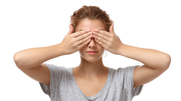 Young woman covering her eyes with hands on transparent background png