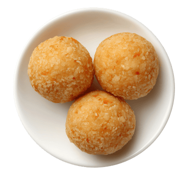 Three golden brown ladoo Indian sweets served on white plate isolated on transparent background png