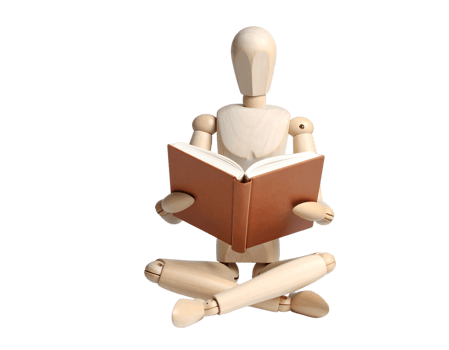A wooden mannequin sitting on the floor reading a book png