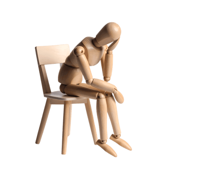 A wooden mannequin sitting on a chair png