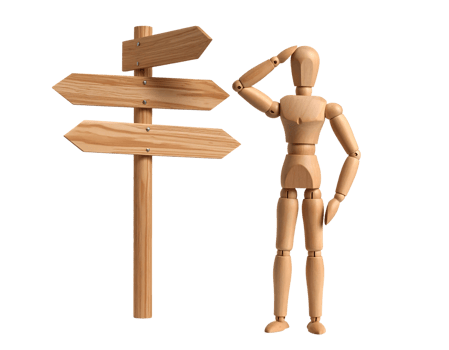 Wooden mannequin standing next to wooden signpost png