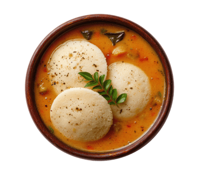 Flavorful Indian dish with steamed rice dumplings in savory sauce png
