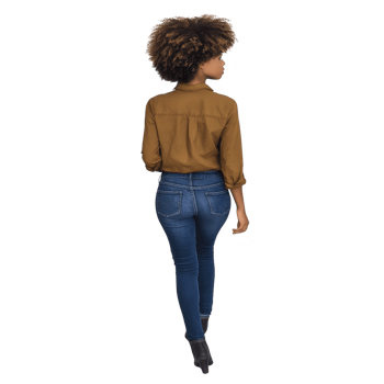 Person with curly hair wearing brown shirt and blue jeans walks confidently. casual outfit and stylish boots add to relaxed yet fashionable look png