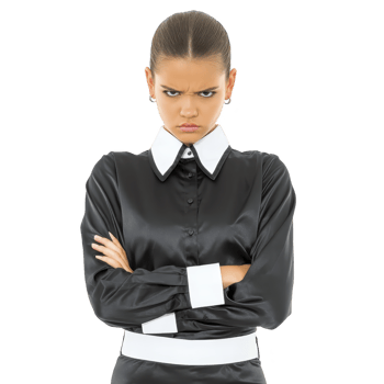 Woman with stern expression stands with arms crossed, wearing black blouse with white cuffs and collar. Her hair is slicked back, emphasizing her serious demeanor png