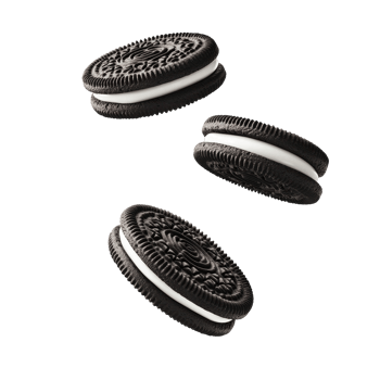 Three chocolate sandwich cookies floating with white cream on transparent background png