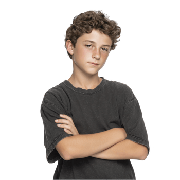 Teen boy with arms folded and calm face wearing dark shirt isolated on transparent background png