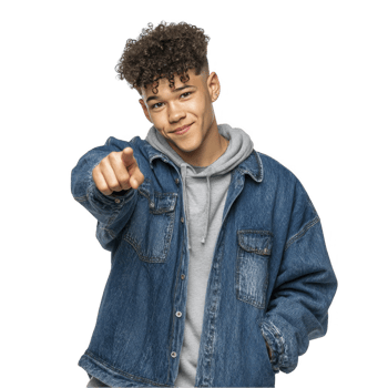 Teen boy in denim jacket pointing toward camera with confident expression isolated on transparent background png