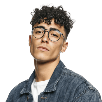 Curly-haired young man with glasses in denim jacket looking confident isolated on transparent background png