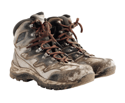 Worn hiking boots ready for adventure in nature exploration png
