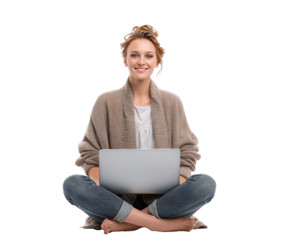 Young woman working on laptop while sitting cross-legged indoors png