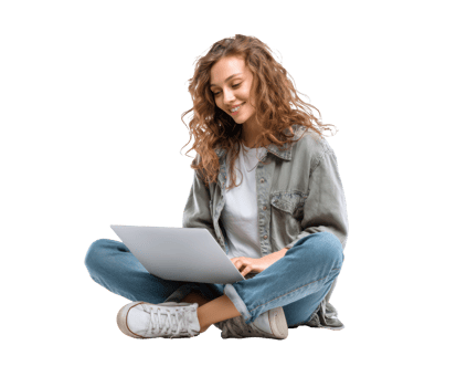 Young woman sitting and working on laptop with a smile png