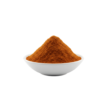 A perfectly formed mound of vibrant orange paprika spice powder presented in a clean white bowl isolated on transparent background png