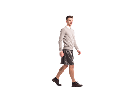 Young Man Walking in Casual Outfit with Leather Shorts and Brown Boots. png
