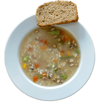 Bowl of vegetable soup with barley and sourdough bread png