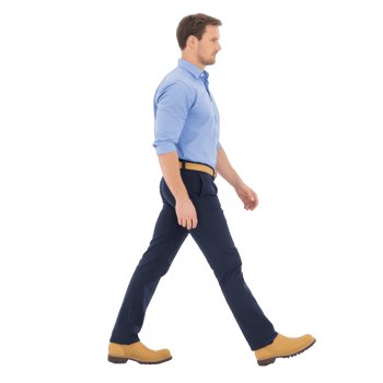 Man in blue shirt and dark pants confidently walks forward, wearing tan shoes. image captures side view, highlighting his determined stride and professional attire png