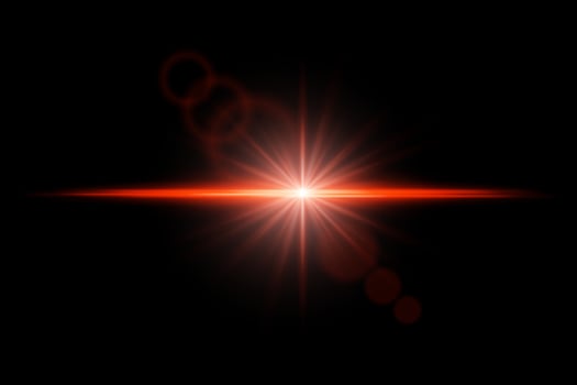 A bright red light shining on a black background vector