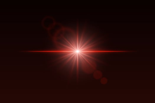 A red light shining on a dark background vector