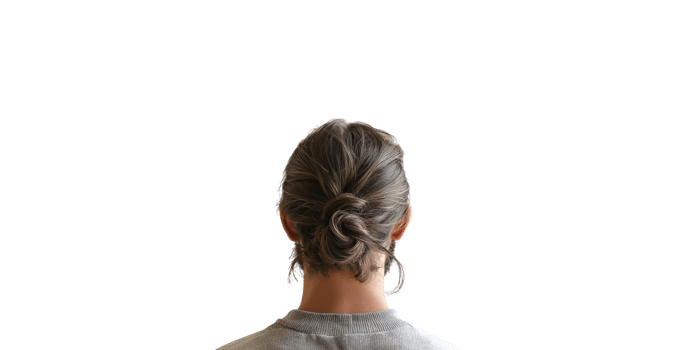 Back view of woman's head with brown hair in a bun isolated on transparent background png