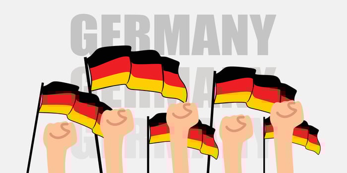 hand with flag of the Germany or Germany independence day illustration of Germany flag with gray background banner or greeting card vector