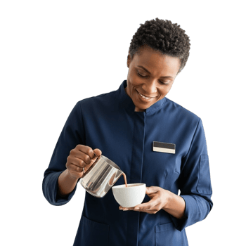 Smiling black woman in uniform pouring coffee into a white cup png